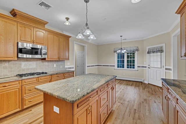 9 Joseph Bow Ct, Pearl River, NY 10965 - kitchen with appliances with stainless steel finishes, a baseboard heating unit, light wood-type flooring, tasteful backsplash, and a chandelier