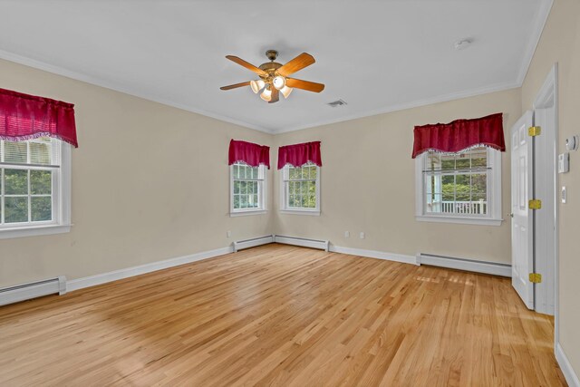 9 Joseph Bow Ct, Pearl River, NY 10965 - empty room with baseboard heating, light wood-style flooring, plenty of natural light, and crown molding