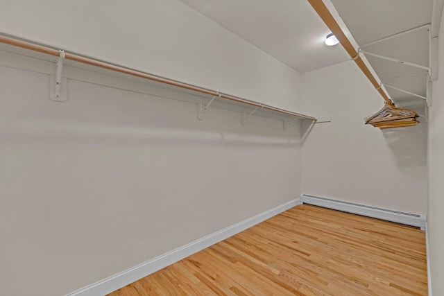 9 Joseph Bow Ct, Pearl River, NY 10965 - walk in closet featuring a baseboard radiator and light wood-style floors