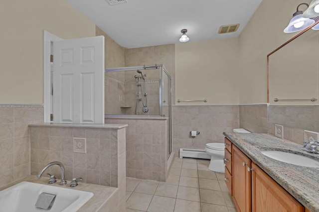 9 Joseph Bow Ct, Pearl River, NY 10965 - bathroom with tile walls, a baseboard radiator, vanity, tile patterned floors, and a stall shower