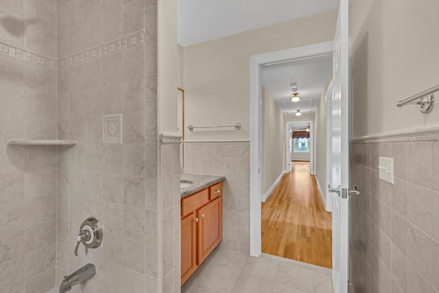 9 Joseph Bow Ct, Pearl River, NY 10965 - full bath featuring tile walls, vanity, tile patterned flooring, shower / bath combination, and wainscoting