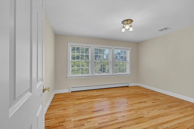 9 Joseph Bow Ct, Pearl River, NY 10965 - spare room featuring baseboard heating, healthy amount of natural light, and light wood-type flooring