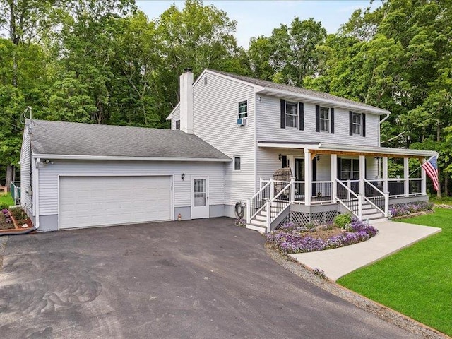 708 Kirbytown Rd, Middletown, NY 10940 - view of front of house featuring covered porch, a garage, asphalt driveway, and a chimney