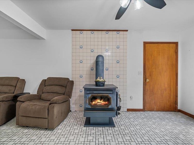 708 Kirbytown Rd, Middletown, NY 10940 - interior space with a wood stove, a ceiling fan, and baseboards