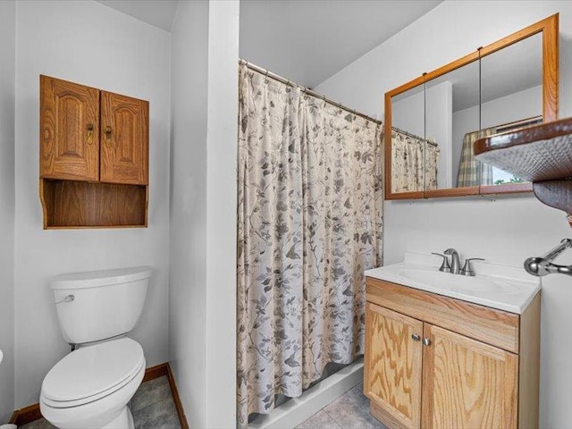 708 Kirbytown Rd, Middletown, NY 10940 - full bathroom with vanity, toilet, curtained shower, tile patterned flooring, and baseboards