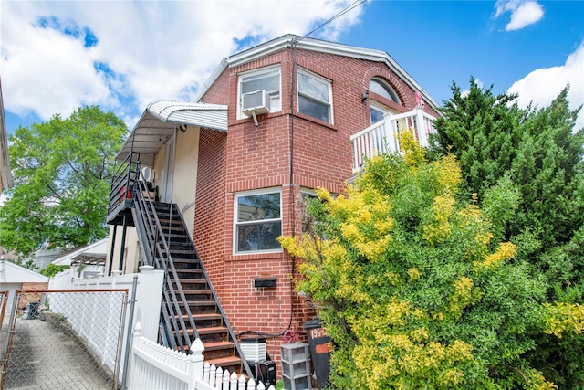 19623 56th Ave, Fresh Meadows, NY 11365 - view of property exterior featuring stairway and brick siding