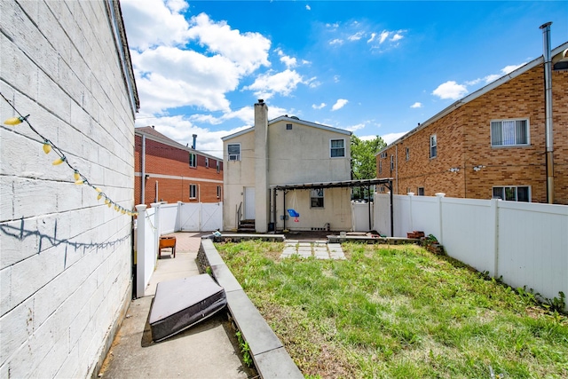 19623 56th Ave, Fresh Meadows, NY 11365 - rear view of property with a fenced backyard and a patio area