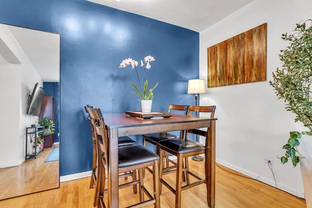 88-01 35th Ave Unit 5F, Jackson Heights, NY 11372 - dining area with wood finished floors and baseboards
