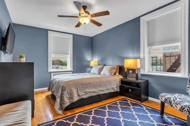 88-01 35th Ave Unit 5F, Jackson Heights, NY 11372 - bedroom featuring wood-type flooring, baseboards, and ceiling fan