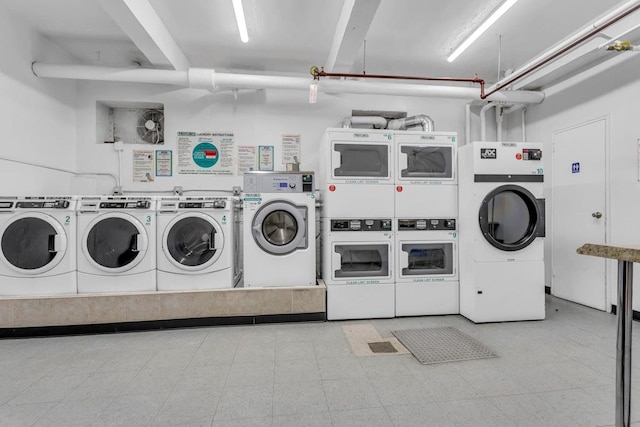 88-01 35th Ave Unit 5F, Jackson Heights, NY 11372 - shared laundry with independent washer and dryer, stacked washing machine and dryer, and tile patterned floors