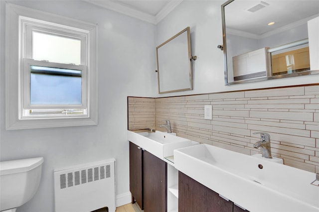 405 Miller Ave, Freeport, NY 11520 - bathroom with radiator heating unit, plenty of natural light, decorative backsplash, toilet, and ornamental molding