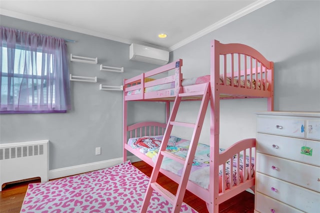 405 Miller Ave, Freeport, NY 11520 - bedroom featuring radiator heating unit, a wall mounted air conditioner, crown molding, baseboards, and wood finished floors