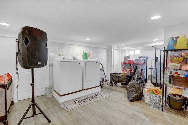 405 Miller Ave, Freeport, NY 11520 - clothes washing area with washing machine and clothes dryer, wood finished floors, and recessed lighting