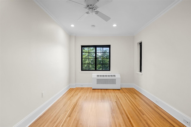 66 Milton Rd Unit C42, Rye, NY 10580 - spare room with radiator heating unit, light wood-style floors, crown molding, baseboards, and recessed lighting