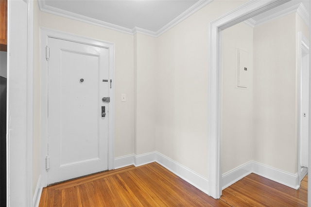 66 Milton Rd Unit C42, Rye, NY 10580 - foyer entrance featuring wood finished floors, baseboards, ornamental molding, and electric panel