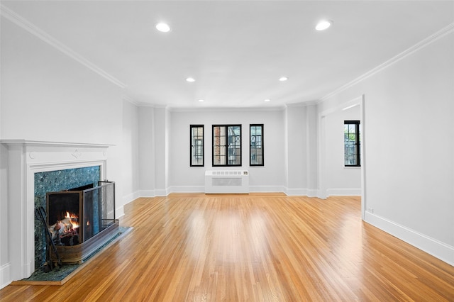66 Milton Rd Unit C42, Rye, NY 10580 - unfurnished living room featuring crown molding, light wood finished floors, a fireplace, baseboards, and recessed lighting