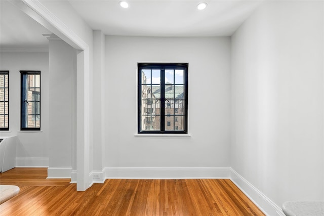 66 Milton Rd Unit C42, Rye, NY 10580 - empty room featuring wood finished floors, baseboards, recessed lighting, and ornamental molding