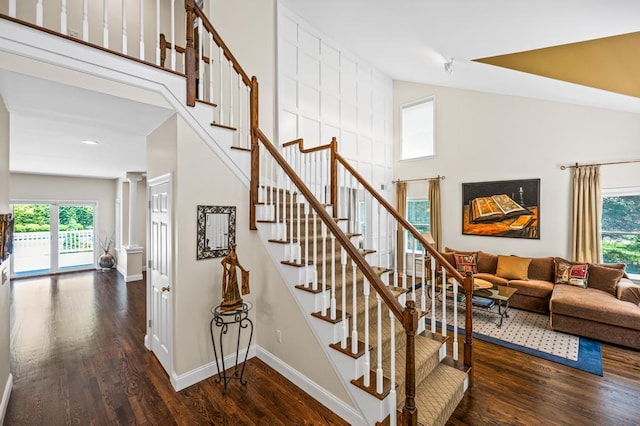 31 Inlet View Path, East Moriches, NY 11940 - stairway featuring plenty of natural light, wood finished floors, a towering ceiling, and baseboards