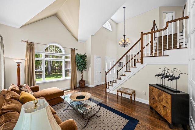 31 Inlet View Path, East Moriches, NY 11940 - living room featuring stairway, high vaulted ceiling, wood finished floors, a chandelier, and baseboards