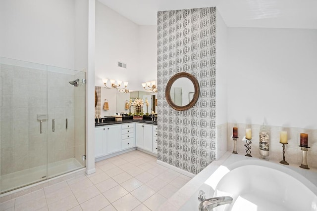 31 Inlet View Path, East Moriches, NY 11940 - bathroom with a stall shower, double vanity, a towering ceiling, a chandelier, and a garden tub
