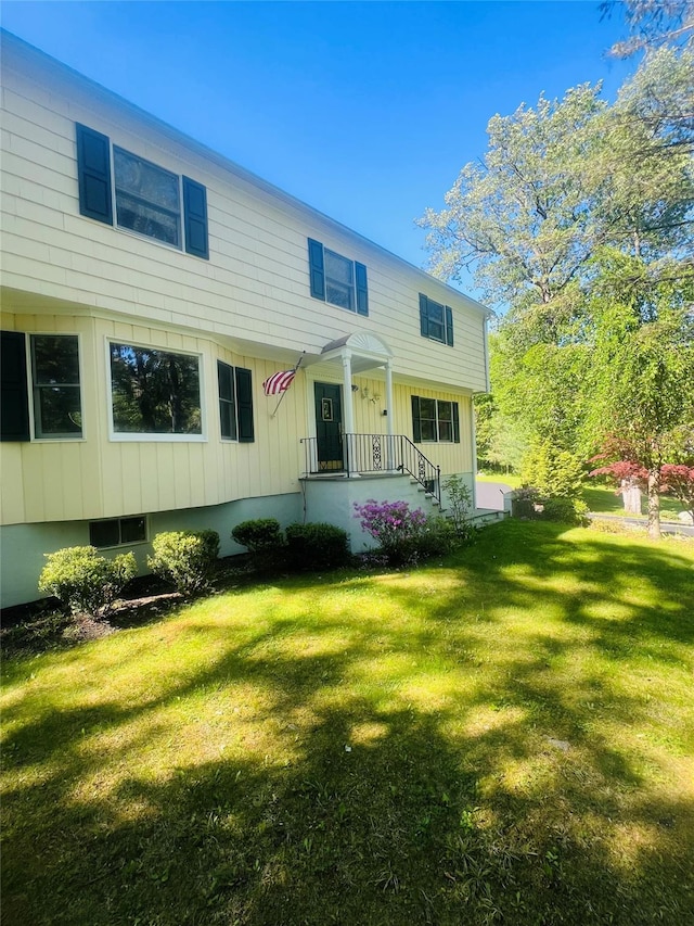 123 E St, South Salem, NY 10590 - colonial inspired home featuring a front lawn and board and batten siding