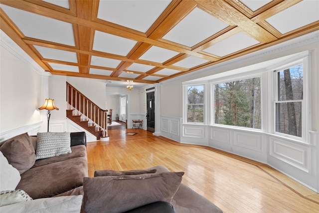 123 E St, South Salem, NY 10590 - living room with coffered ceiling, hardwood / wood-style flooring, healthy amount of natural light, a decorative wall, and wainscoting