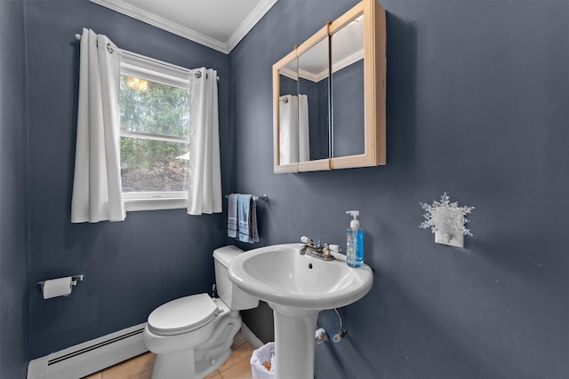 123 E St, South Salem, NY 10590 - half bathroom with a baseboard radiator, toilet, ornamental molding, tile patterned flooring, and a sink