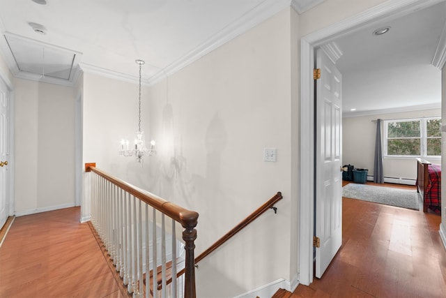 123 E St, South Salem, NY 10590 - hall featuring attic access, an upstairs landing, wood finished floors, and crown molding