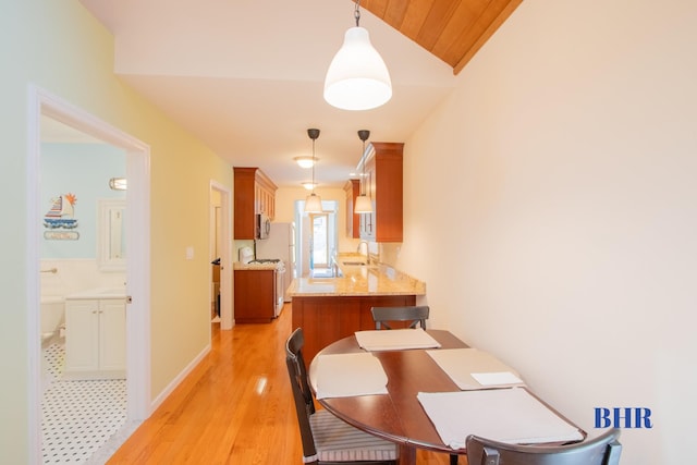 120 Norfolk St, Brooklyn, NY 11235 - dining space with lofted ceiling, light wood-style flooring, and baseboards