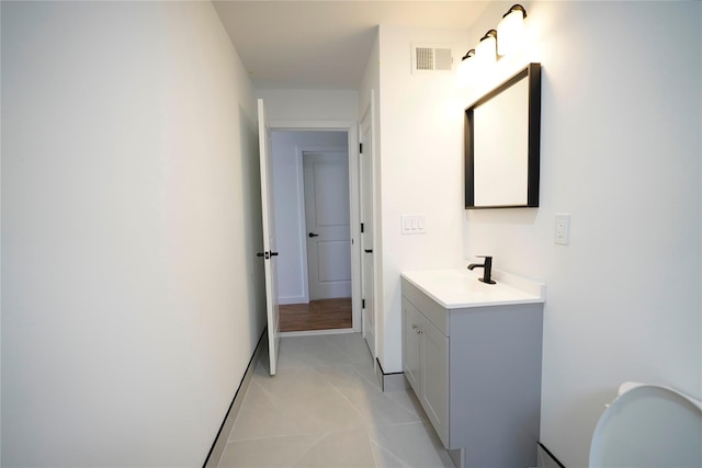 bathroom with tile patterned flooring and vanity