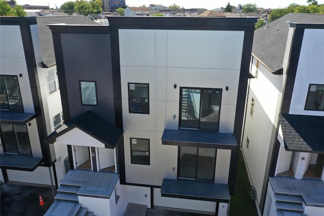 back of property with stucco siding