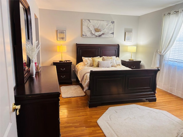bedroom with light wood-style floors