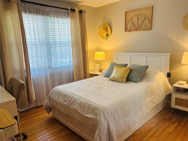 bedroom with wood finished floors