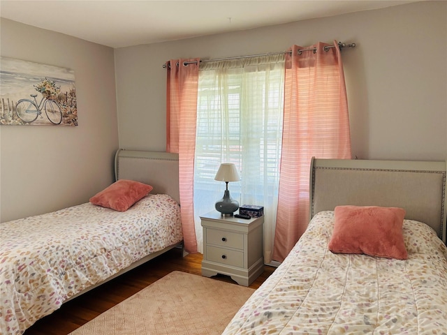 bedroom with wood finished floors