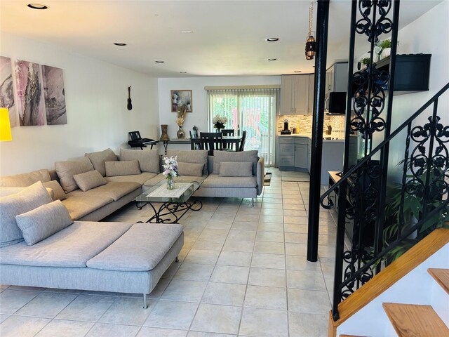living area featuring light tile patterned flooring and recessed lighting