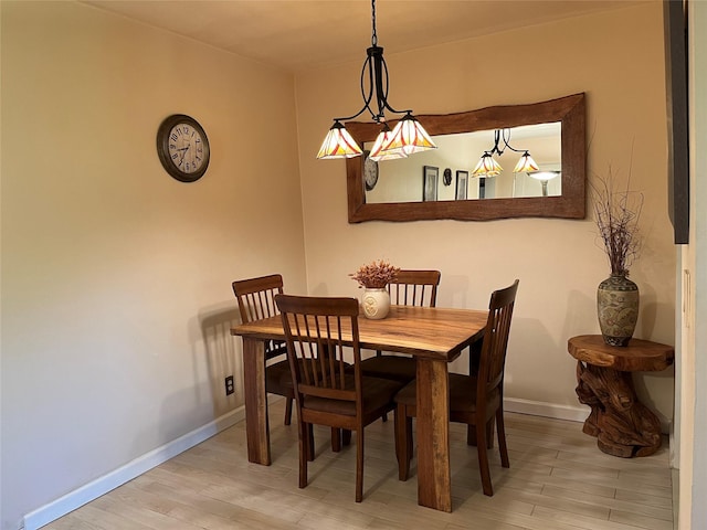 19933 22nd Avenue -, Whitestone, NY 11357 - dining space with light wood-style flooring and baseboards