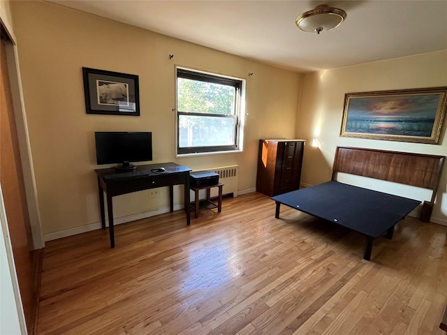 19933 22nd Avenue -, Whitestone, NY 11357 - living area featuring wood finished floors, radiator, and baseboards