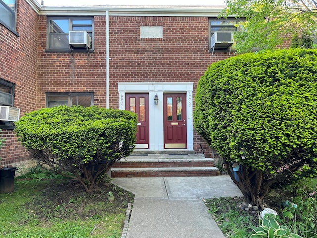 19933 22nd Avenue -, Whitestone, NY 11357 - doorway to property with brick siding and cooling unit