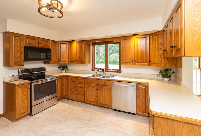 162 Lippincott Rd, Wallkill, NY 12589 - kitchen featuring stainless steel appliances, brown cabinets, and light countertops