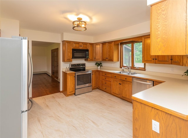 162 Lippincott Rd, Wallkill, NY 12589 - kitchen with stainless steel appliances, brown cabinets, and light countertops