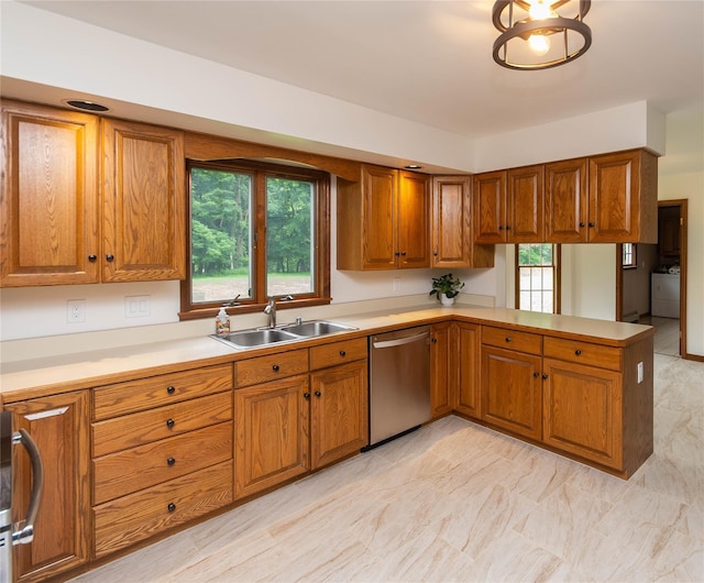 162 Lippincott Rd, Wallkill, NY 12589 - kitchen with stainless steel dishwasher, brown cabinets, light countertops, a peninsula, and range
