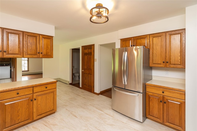 162 Lippincott Rd, Wallkill, NY 12589 - kitchen with freestanding refrigerator, brown cabinets, and light countertops