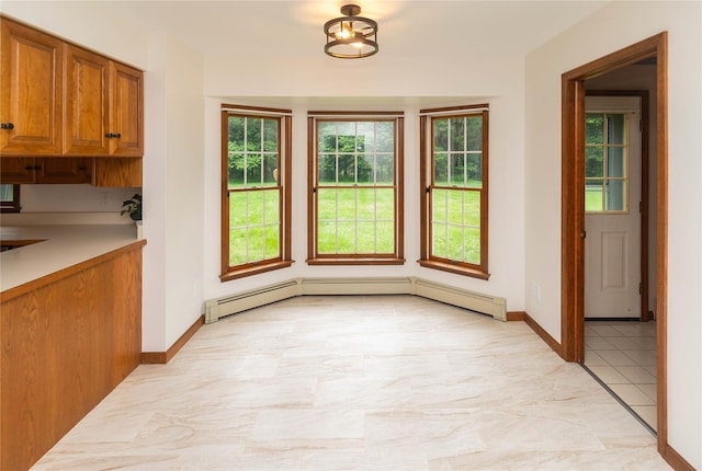 162 Lippincott Rd, Wallkill, NY 12589 - unfurnished dining area featuring baseboards and light marble finish flooring