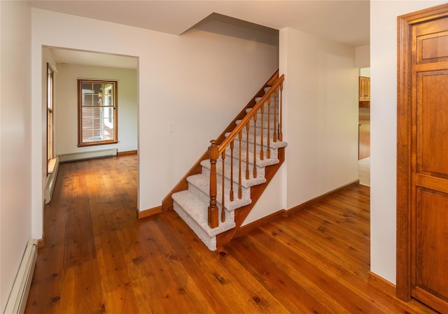 162 Lippincott Rd, Wallkill, NY 12589 - staircase with baseboard heating and hardwood / wood-style flooring