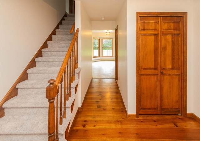 162 Lippincott Rd, Wallkill, NY 12589 - staircase with wood-type flooring and baseboards
