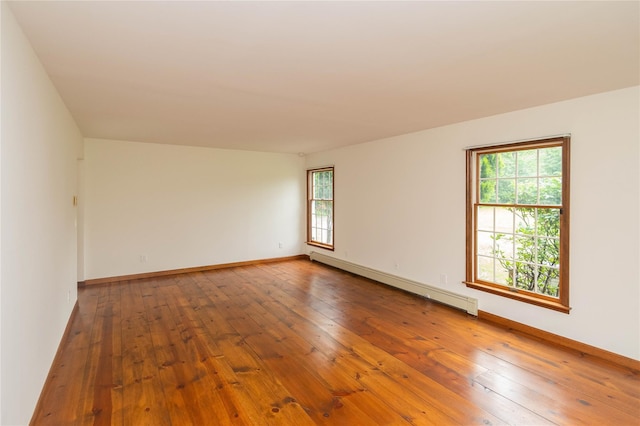 162 Lippincott Rd, Wallkill, NY 12589 - unfurnished room featuring baseboard heating and hardwood / wood-style flooring