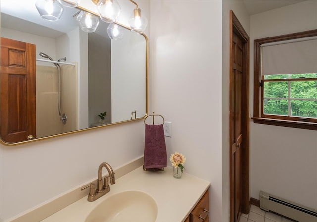 162 Lippincott Rd, Wallkill, NY 12589 - bathroom featuring a baseboard radiator, vanity, tile patterned flooring, and a shower
