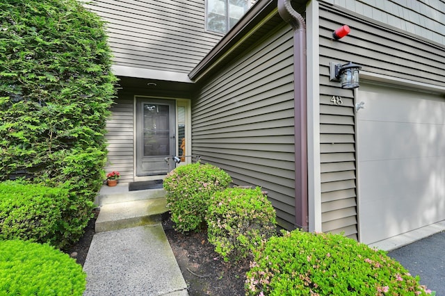 48 Old Lake Rd, Congers, NY 10920 - view of exterior entry with a garage
