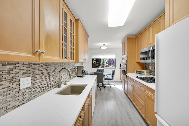 48 Old Lake Rd, Congers, NY 10920 - kitchen with stainless steel appliances, a sink, light wood-type flooring, decorative backsplash, and light brown cabinets