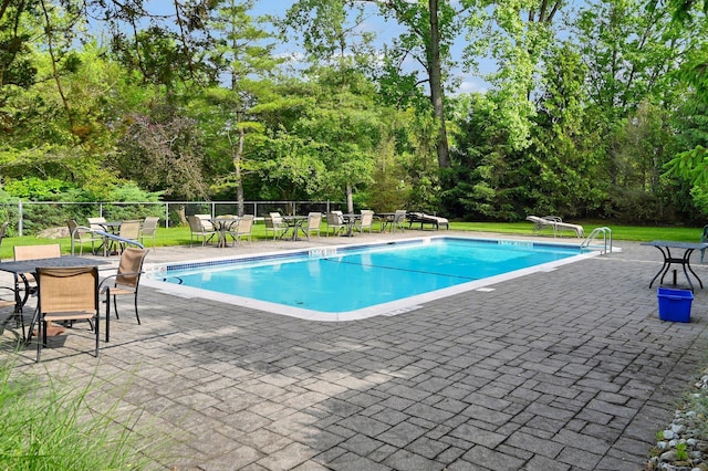 48 Old Lake Rd, Congers, NY 10920 - community pool featuring a patio and view of wooded area